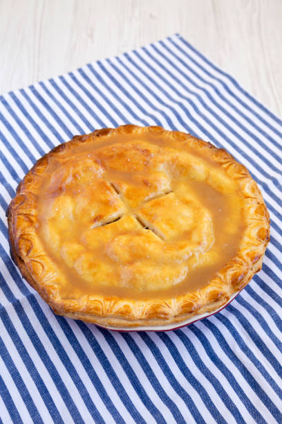 istock Fresh Homemade Salted Caramel Apple Pie, low angle view. 1442429368