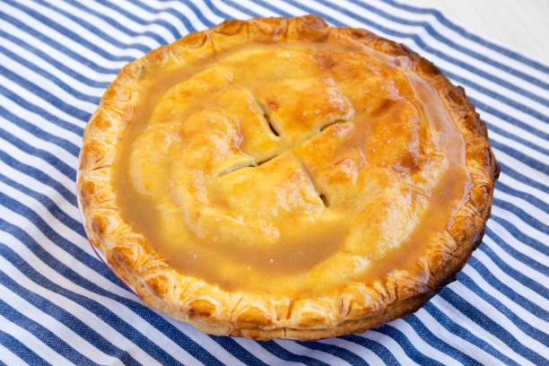 istock Fresh Homemade Salted Caramel Apple Pie, low angle view. 1442429389
