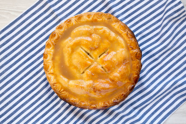 istock Fresh Homemade Salted Caramel Apple Pie, top view. Flat lay, overhead, from above. 1442429504