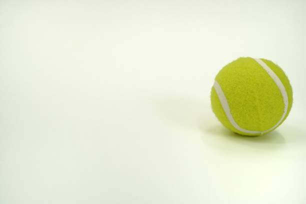 istock An image showing a tennis ball on a white background, isolated. 1442431345
