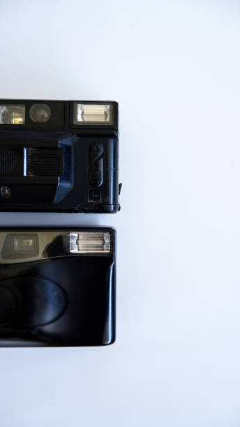 istock Two Retro Film Cameras On A White Background 1442432208