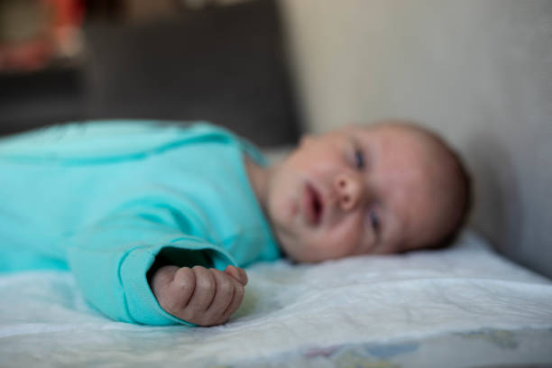 istock One-month-old baby's fist in focus. 1442436736