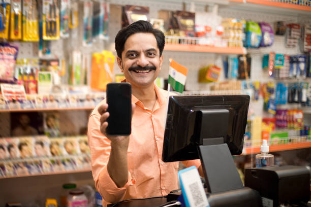 istock Owner at checkout counter in supermarket 1442437498