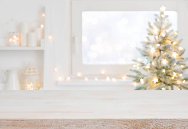 istock Empty table in front of christmas tree with decoration background 1442440015