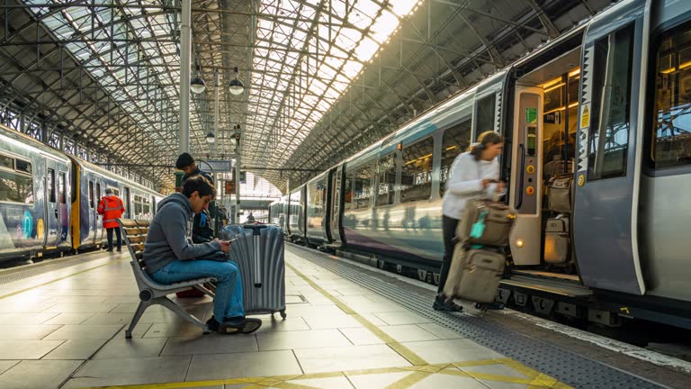 Time lapse of Crowded Commuter Tourist entering to Train in Manchester Piccadilly station in Manchester City