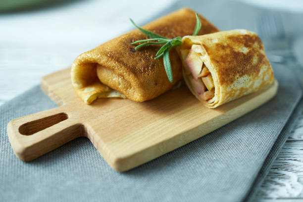 istock Pancakes with apples, close-up on a wooden background. 1442443943