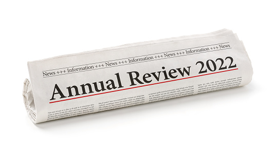Rolled newspaper with the headline Annual review 2022