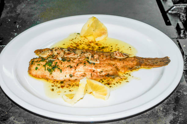 Sole meuniere with parsley and lemon. stock photo