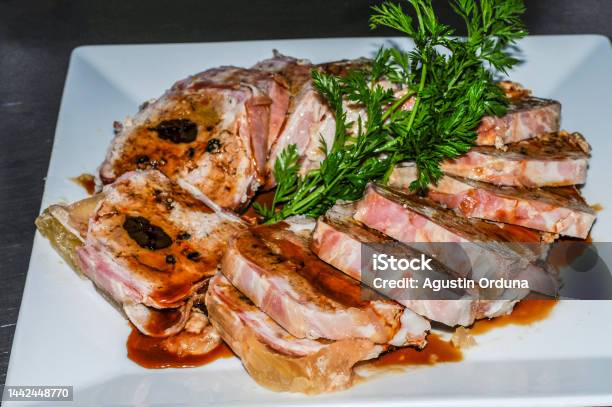 Rolled Meatloaf With Sauce Presented In Slices On A White Plate Stock Photo - Download Image Now