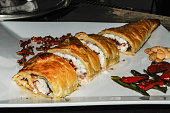 Stuffed whiting wrapped in a decorated sheet of puff pastry
