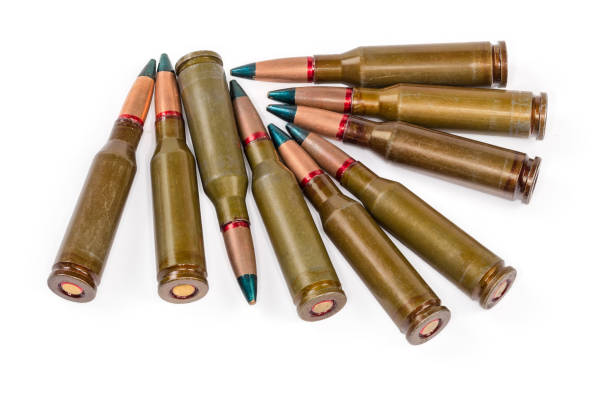 istock Tracer rifle cartridges with green tip on a white background 1442454152
