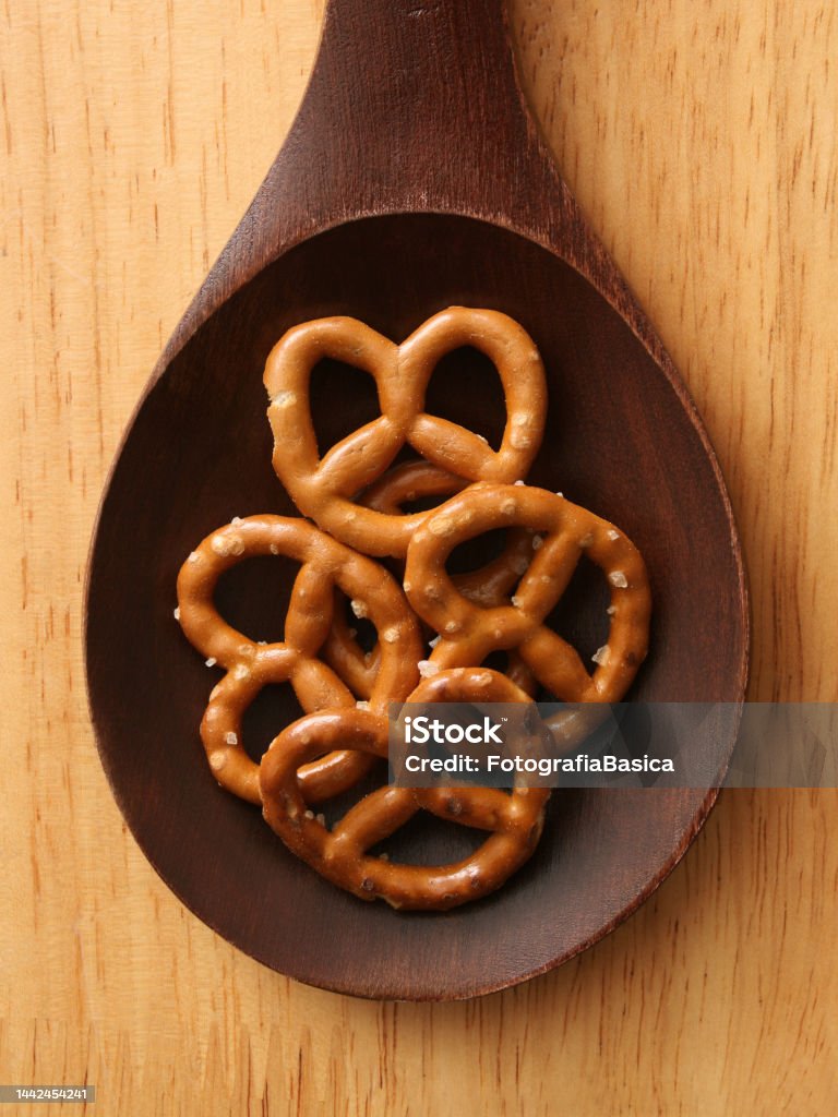 Pretzels Top view of wooden spoon with pretzels on it Baked Stock Photo