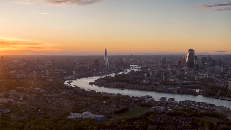 Elevated sunset to night time lapse view of the urban skyline of London