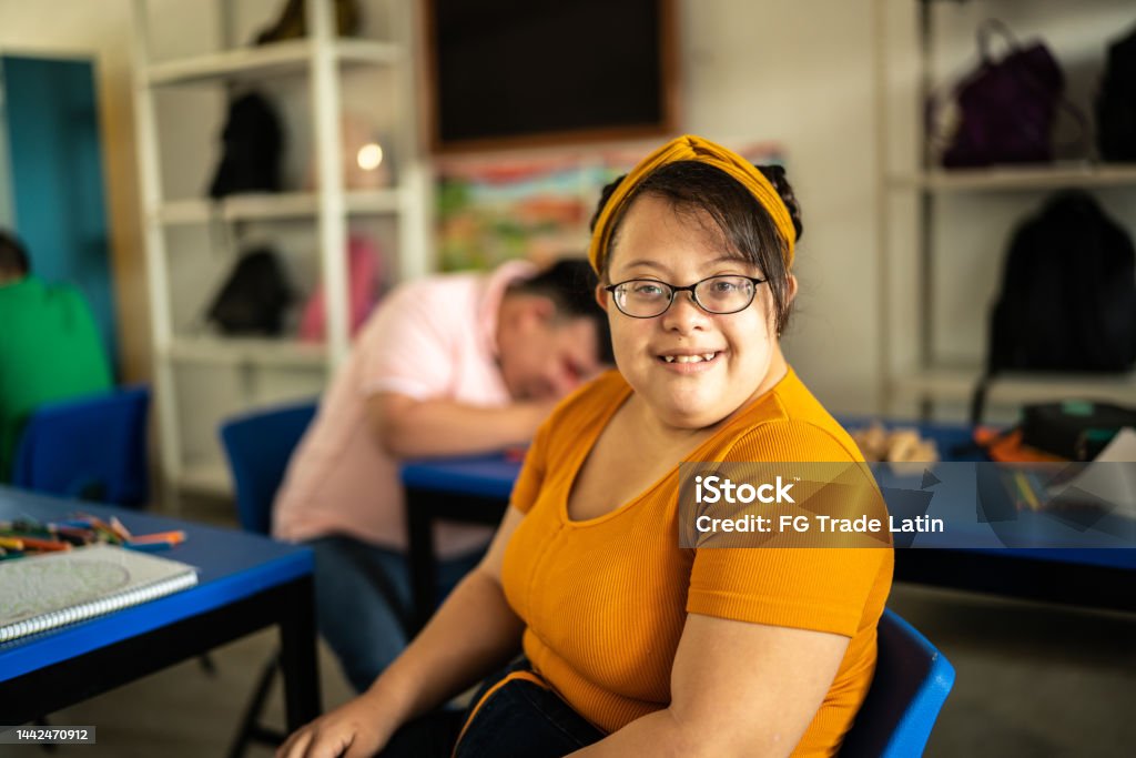 Portrait of a young special needs in the classroom at school Disability Stock Photo