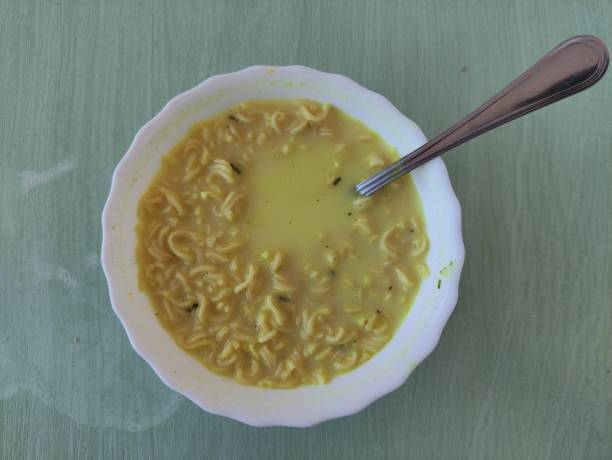 istock Instant noodles in a plate with a spoon, view from above 1442474345