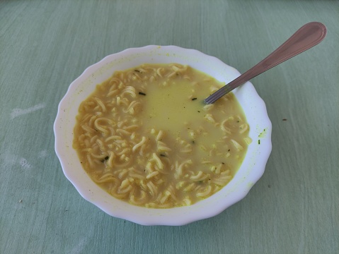 Instant noodles in a plate with spoon