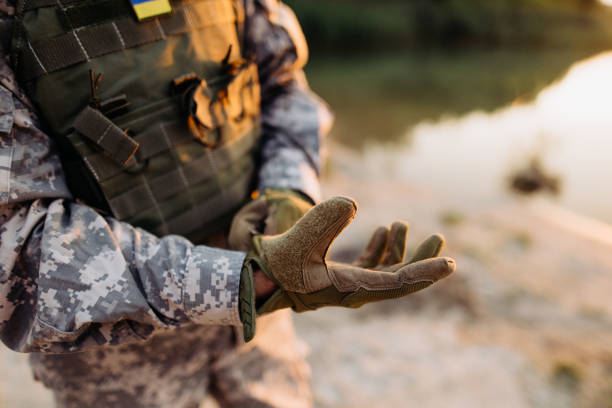 istock A male soldier puts on tactical gloves 1442476145