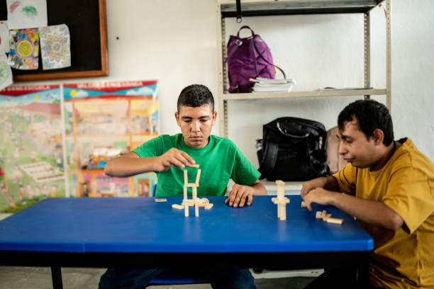 istock Psychomotor Intellectual disability students playing with didactic toys in the classroom at school 1442476298