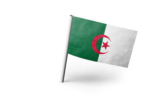 Algerian flag pinned. Isolated on white background. Horizontal orientation. Close up photography. Copy space.