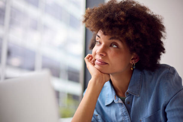 istock Thoughtful Young Businesswoman In Modern Office Working On Laptop Using Wireless Headset 1442476831