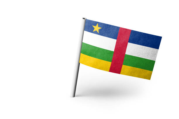 Small paper flag of of Central African Republic pinned. Isolated on white background. Horizontal orientation. Close up photography. Copy space.