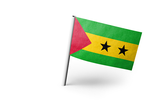 Small paper flag of Sao Tome and Principe pinned. Isolated on white background. Horizontal orientation. Close up photography. Copy space.