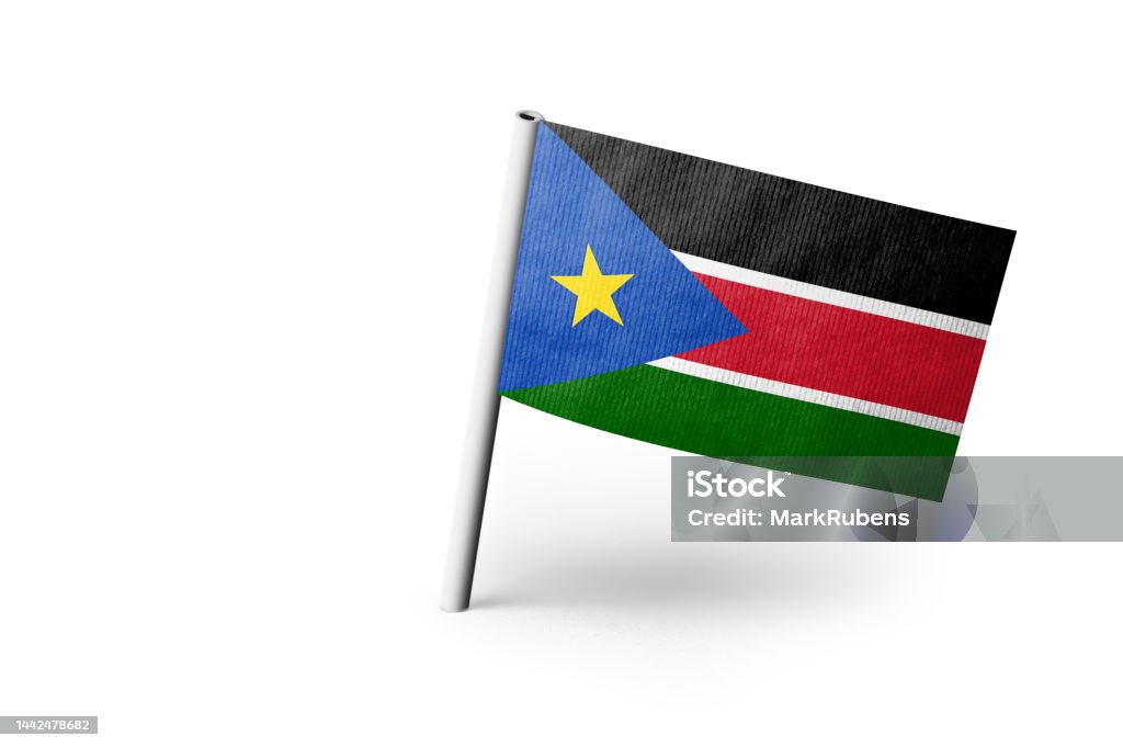 South Sudan flag pinned. White background Small paper flag of South Sudan pinned. Isolated on white background. Horizontal orientation. Close up photography. Copy space. Africa Stock Photo