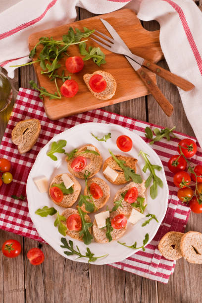istock Friselle with cherry tomatoes and arugula. 1442478800