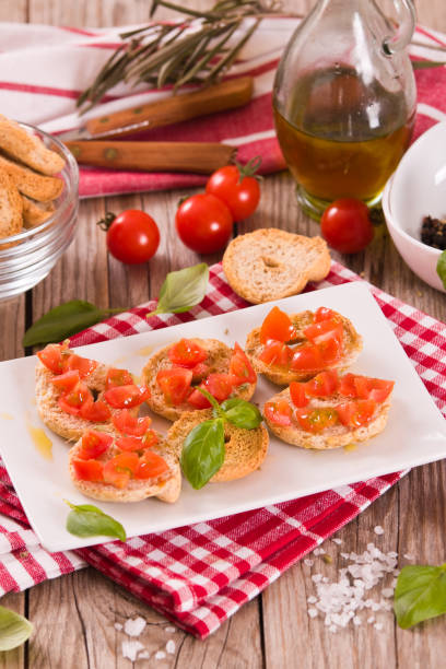 istock Friselle with cherry tomatoes and basil. 1442478966