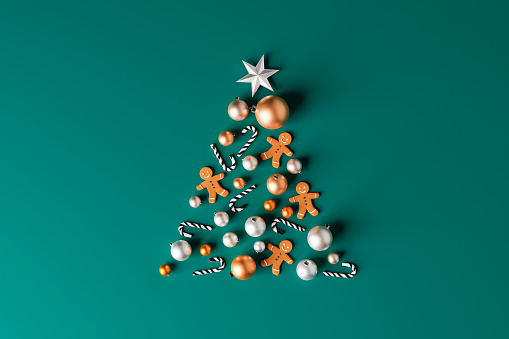 3d illustration of arranged sweet candy canes with gingerbread man cookies and shiny baubles in shape of Xmas tree on green background