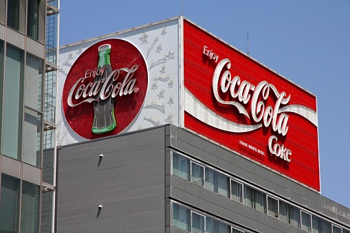 Street view of Coca-Cola huge neon billboard advertisement in Nagoya, Japan.