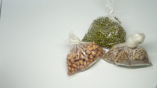 Peanut Mung beans and nut wrapped in clear plastic isolated on white background