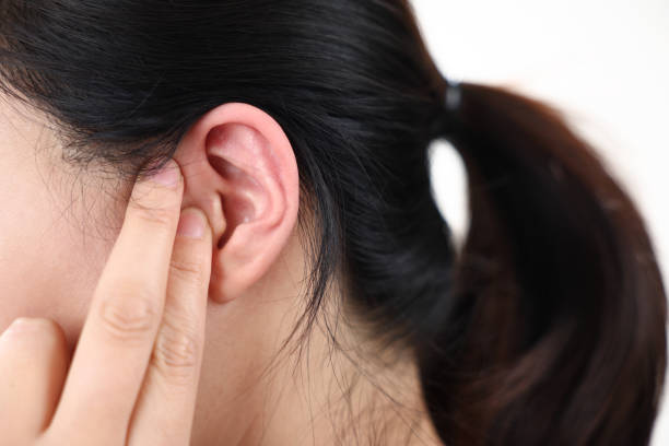 istock side view of woman's ear 1442482944