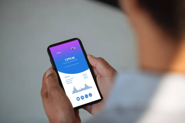 istock Unrecognisable African man holding phone and dealing with finances as seen on device screen 1442483852