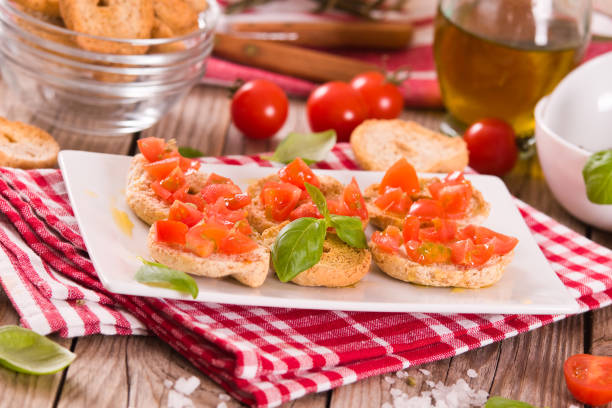 istock Friselle with cherry tomatoes and basil. 1442484527