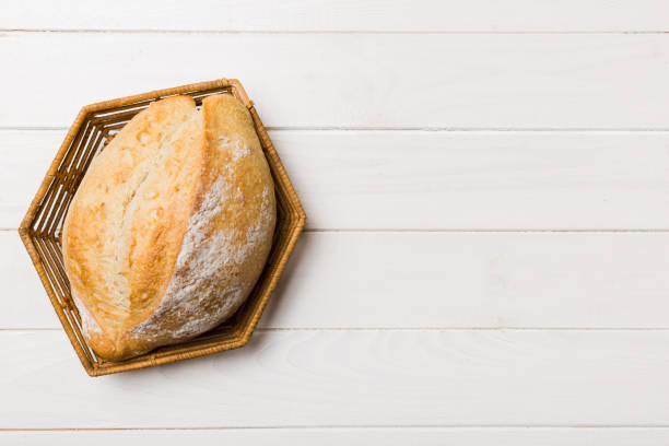 istock Freshly baked bread on basket against natural background. top view bread copy space 1442486626