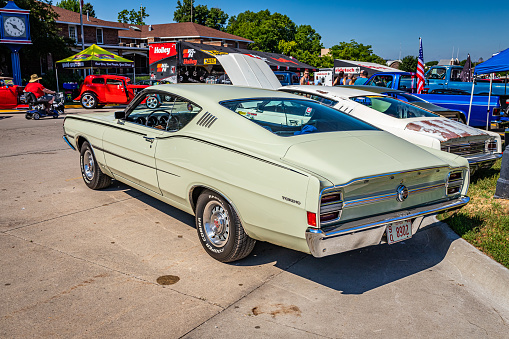 Des Moines, IA - July 03, 2022: High perspective rear corner view of a 1968 Ford Torino GT Fastback at a local car show.