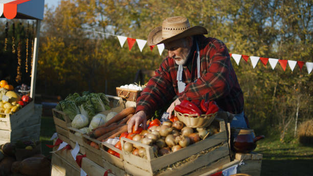 istock Farmer lays out fruits or vegetables 1442488120