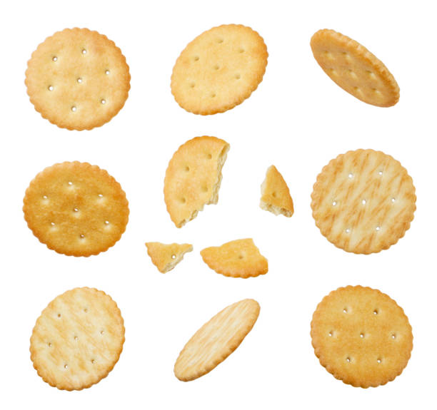 istock Set of round crackers and broken cut out on a white background. 1442489042