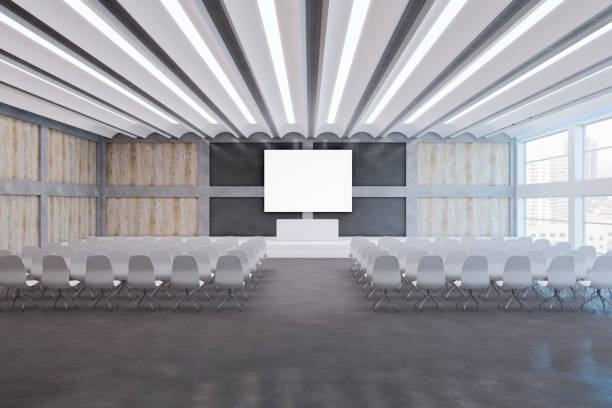 istock Modern loft style concrete and wooden auditorium with empty white mock up banner, window and city view, stage and many chairs. 3D Rendering. 1442489870