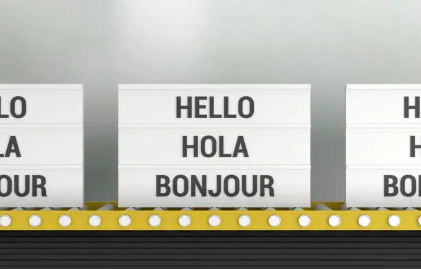 Lightbox with the word Hello Hola Bonjour on the production line. Communication Concept.
