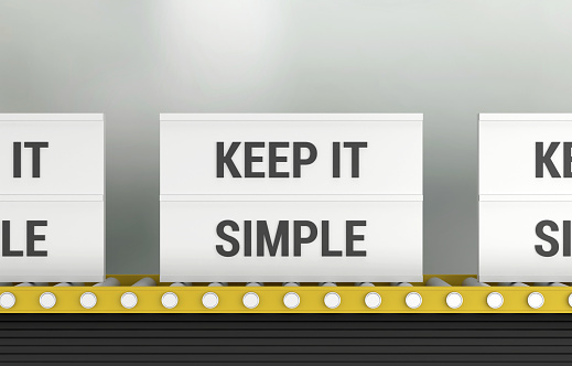 Lightbox with the word Keep It Simple on the production line