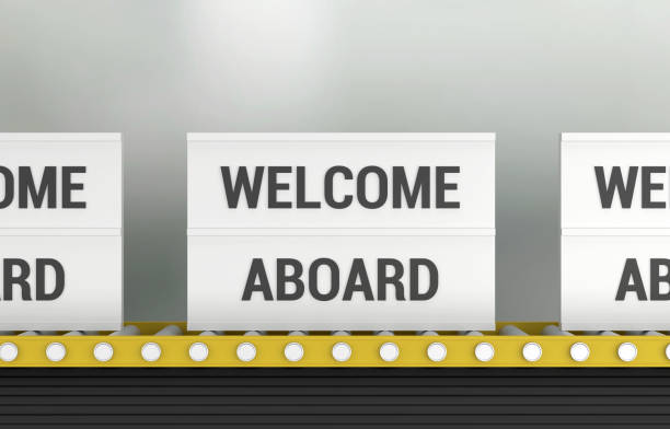 Lightbox with the word Welcome Aboard on the production line. Communication Concept.