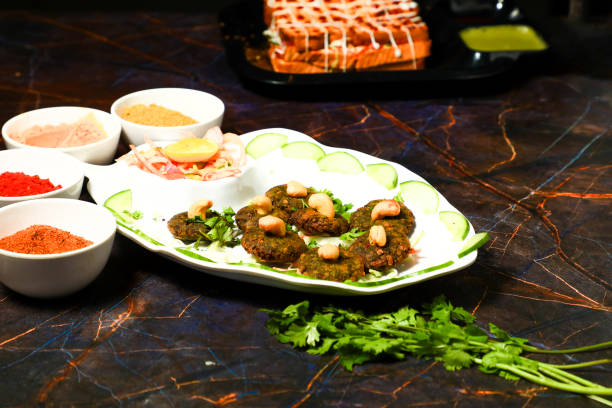 istock Indian Side Dish Popular Chaat Snacks Aaloo Aalu Mashed Boiled Potato Tikki With Spicy Green Chutney And Tomato Sauce 1442491345