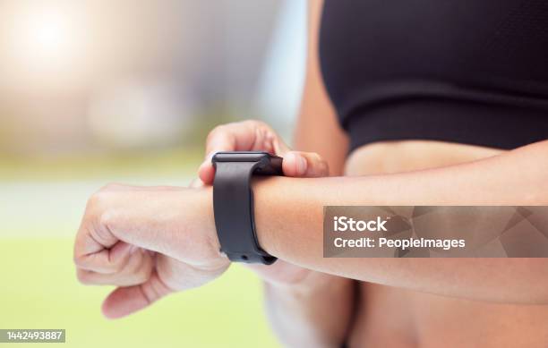 Smartwatch On Hands Of Runner To Track Woman Running Time Health Stats And Train For Competition Race Smart Watches Help Competitive Performance Motivate And Inspire Athlete To Improve Record Time Stock Photo - Download Image Now