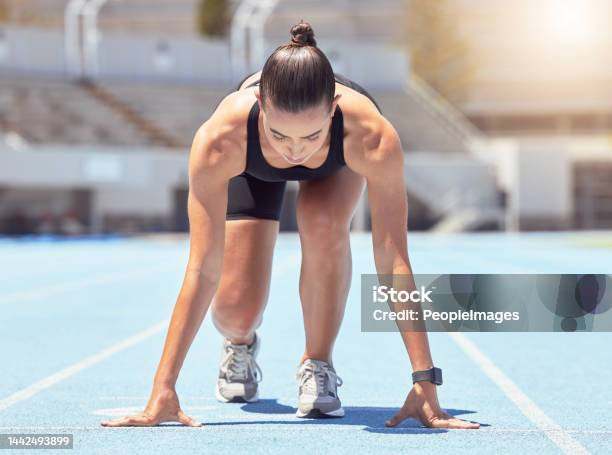 Motivation Energy And Runner Start Training At Outdoor Track Ready To Practice Go Health Power And Fitness Goal By Professional Woman Athlete With Strong Mindset Prepare For Speed Cardio Sprint Stock Photo - Download Image Now