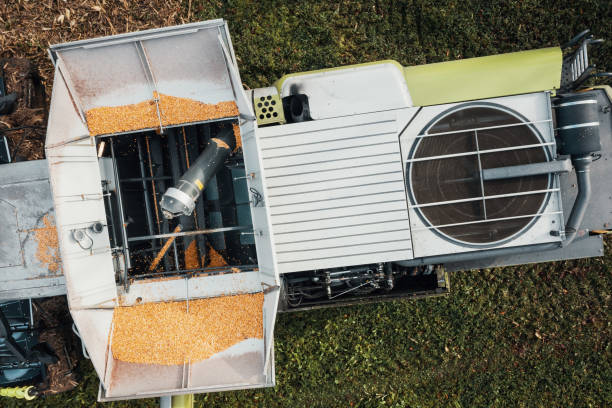 istock aerial view of a harvester unloading the corn into the trailer 1442494162
