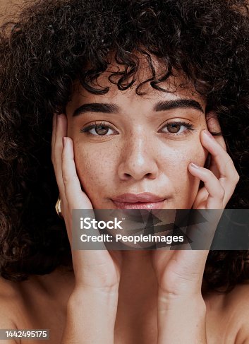 istock Beauty, portrait and natural face of black woman with healthy freckle skin texture touch. Aesthetic, facial and skincare cosmetic model girl touching cheeks for self love and wellness. 1442495175
