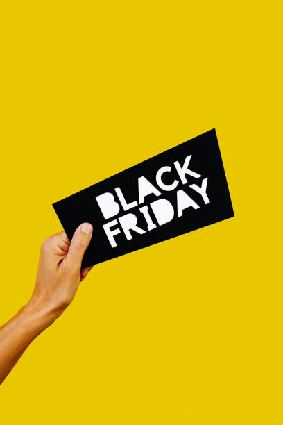 istock holds a black sign with the text black friday 1442495624