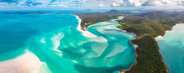Panorama of Hill Inlet on a sunny day in Whitsundays Island in Great Barrier Reef, Australia stock photo